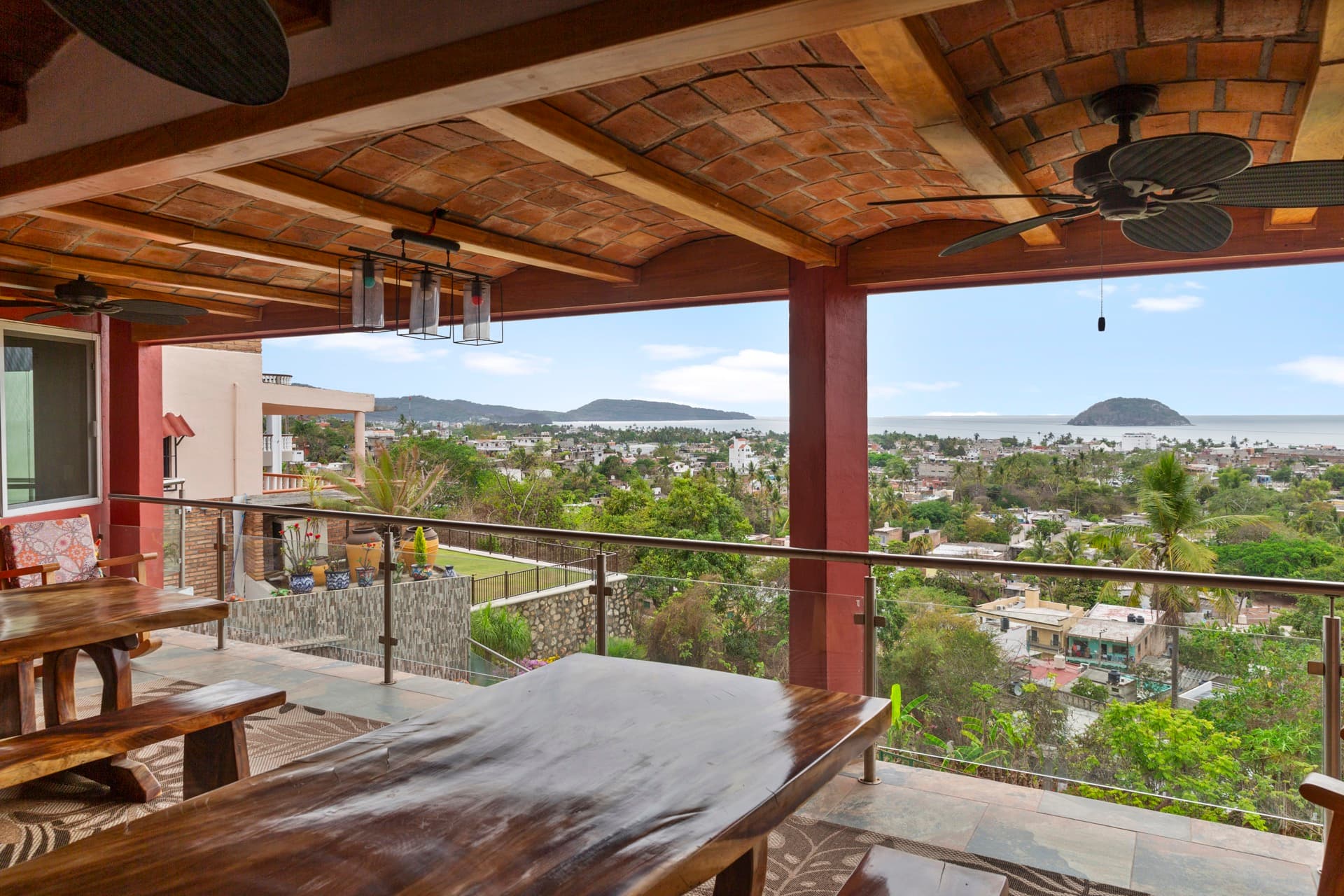 Interior living space with exposed wooden beams and panoramic mountain views