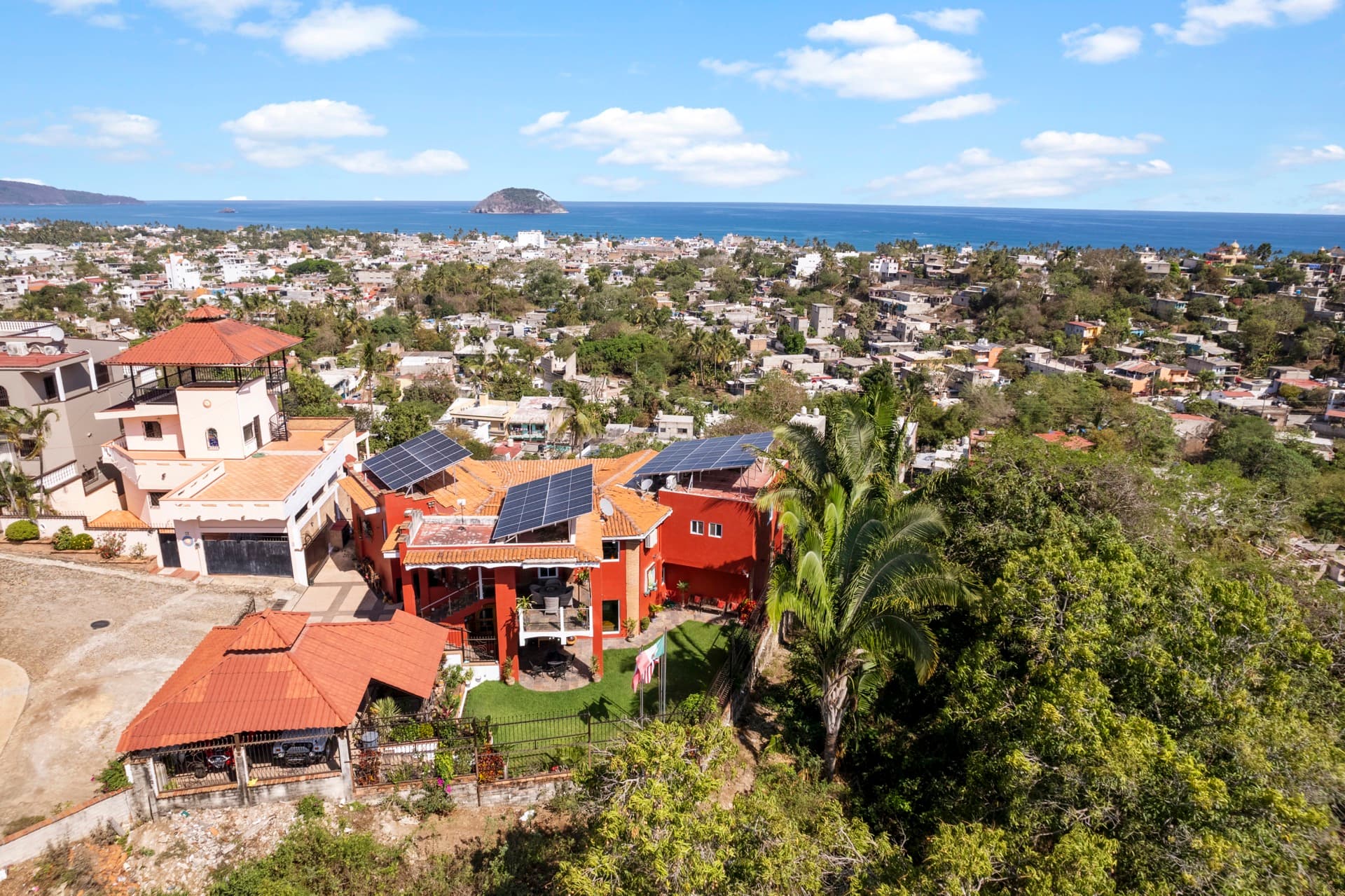 Aerial view of Casa Nayarit with Isla Coral island visible in ocean background